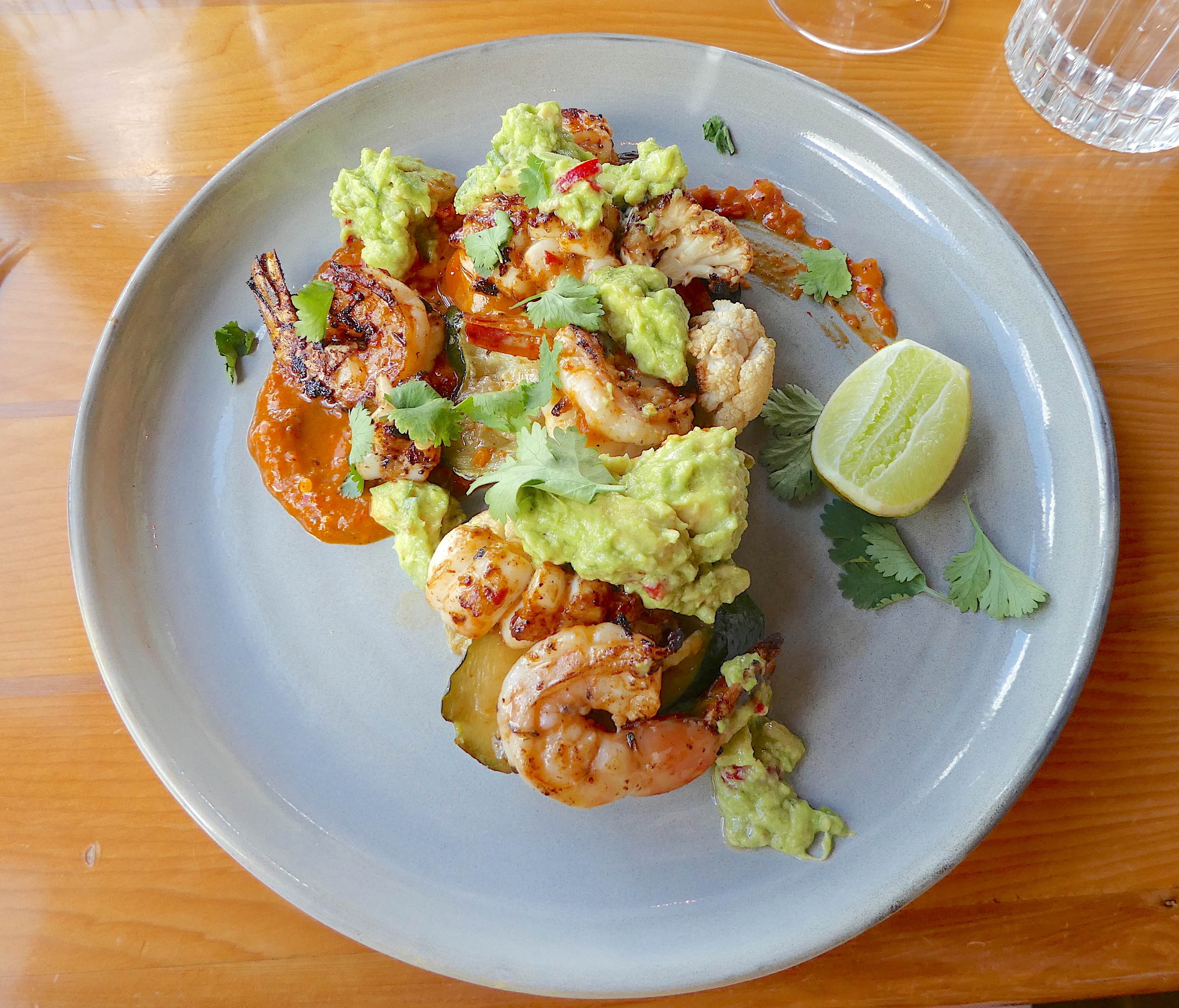 16.grilled harissa southern calamari &amp; banana prawns with rustic guacamole, grilled summer vegetables, coriander &amp; paprika oil